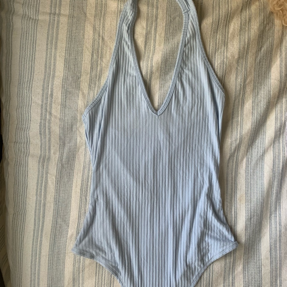 Light blue body suit with a scoop back.